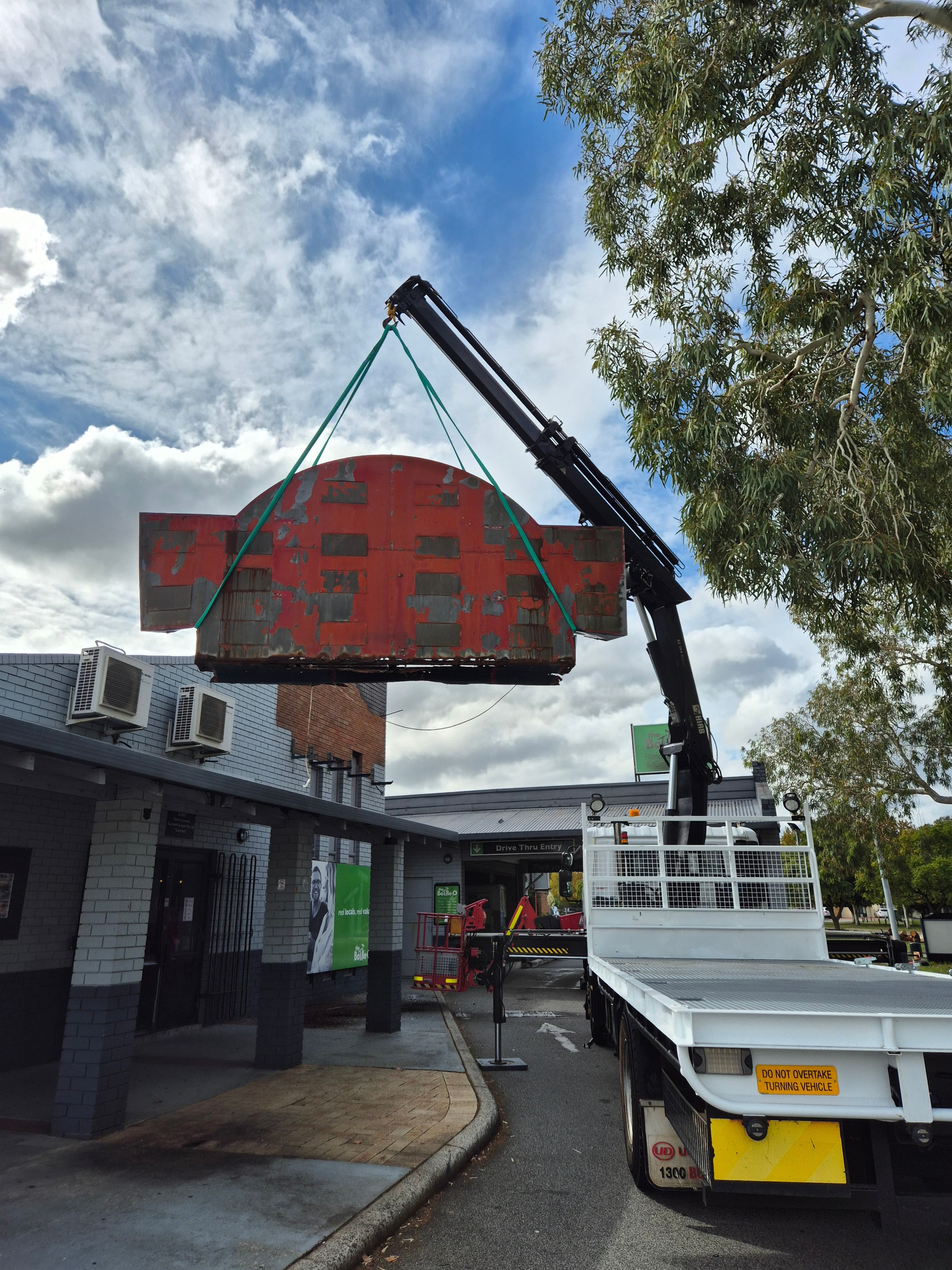 Susa Cranes HIAB — sign removal: old retail signage decommissioned for rebrand or demo